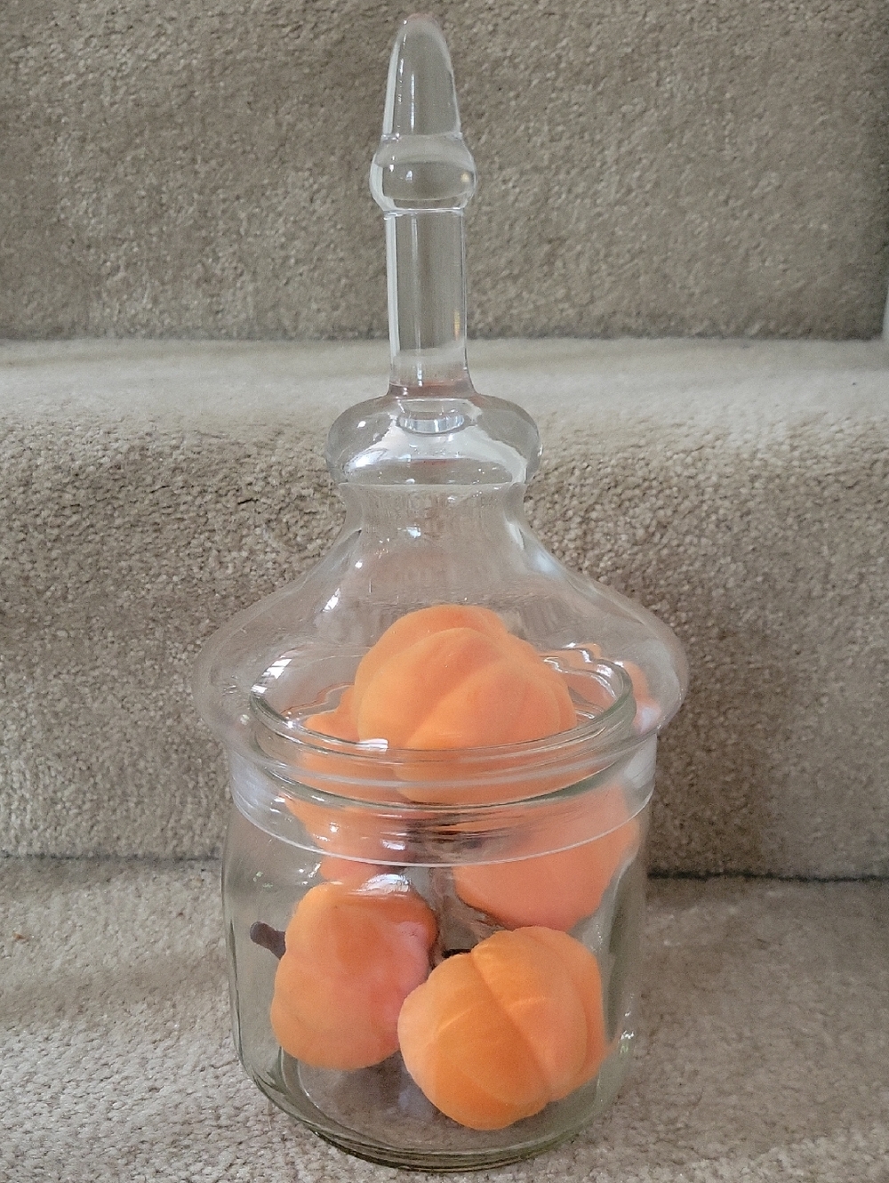 Clear Glass Apothecary Jar with Decorative Lid. THE BOTTOM IS A BIG MASON JAR.